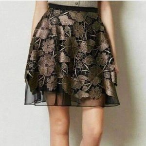 A line Eva Franco skirt flowers gold and black